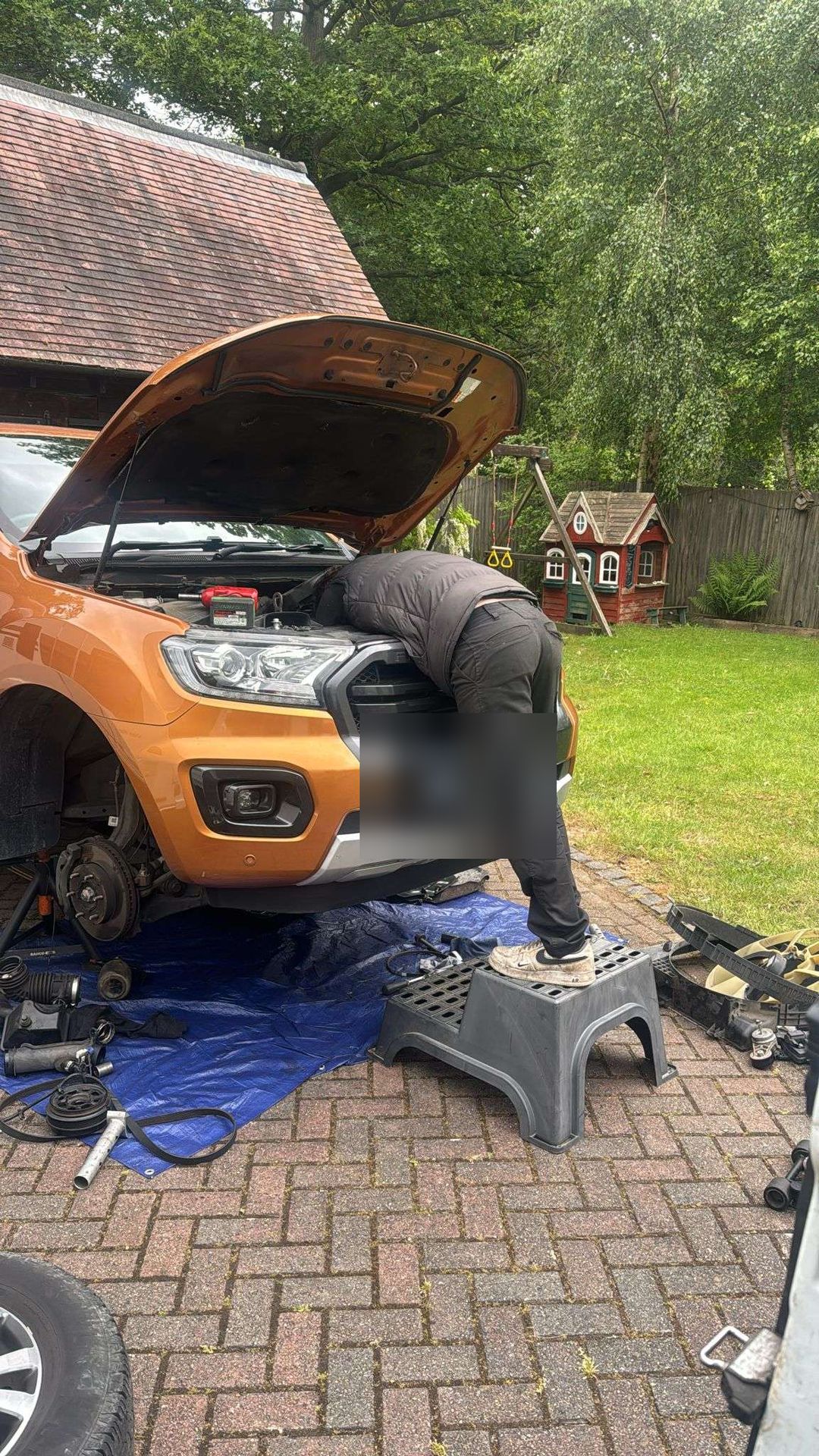 Jack Stone, Founder & lead technician at Stone Auto, working on a Ford Ranger