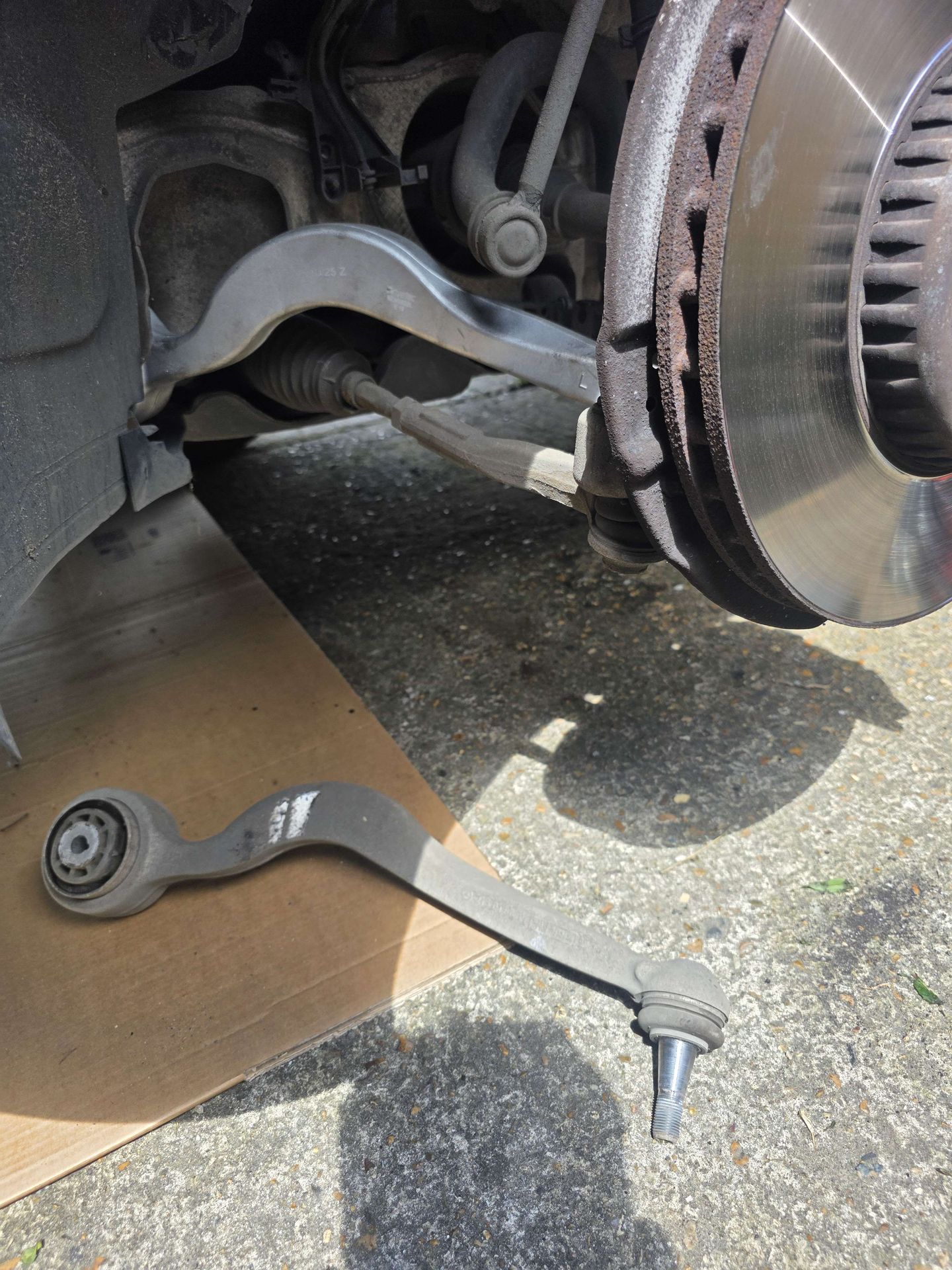 A suspension control arm replaced on the vehicle